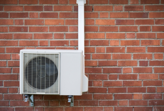 Boiler in front of red bricks